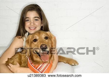 Female holding Golden Retriever dog View Large Photo Image Stock Image - Female holding Golden Retriever dog. Fotosearch
