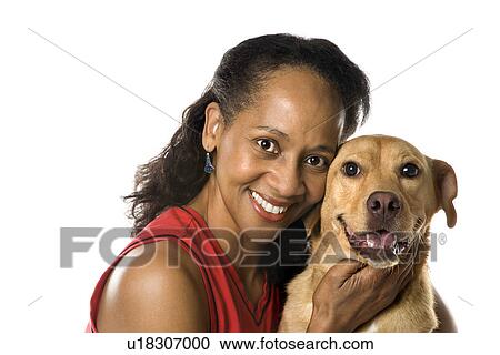 Stock Image - Female with dog. Fotosearch