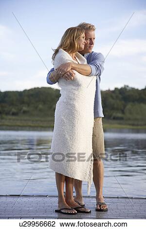 Couple hugging on pier View Large Photo Image Stock Image - Couple hugging on pier. Fotosearch