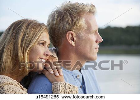 Couple looking into distance View Large Photo Image Stock Photography - Couple looking into distance. Fotosearch