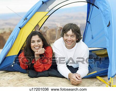 Couple lying in tent, portrait View Large Photo Image Stock Photograph - Couple lying in tent, portrait. Fotosearch