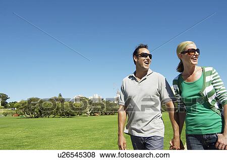 Mature couple looking at view in park View Large Photo Image Stock Photo - Mature couple looking at view in park. Fotosearch