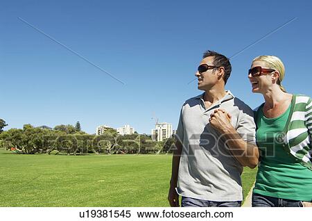 Mature couple looking at view in park View Large Photo Image Stock Photography - Mature couple looking at view in park. Fotosearch