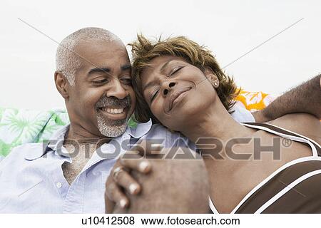 Mature couple relaxing View Large Photo Image Stock Photo - Mature couple relaxing. Fotosearch