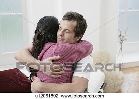 Mid adult couple hugging View Large Photo Image Stock Image - Mid adult couple hugging. Fotosearch