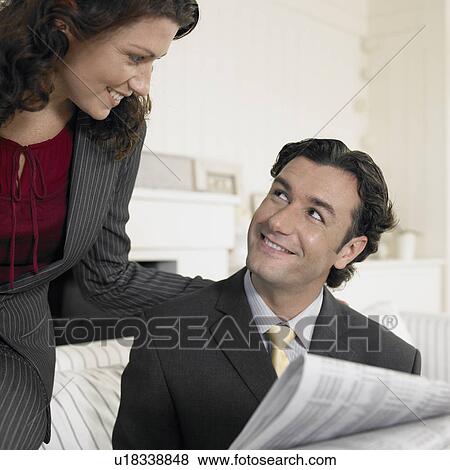 Mid adult looking at each other View Large Photo Image Stock Photo - Mid adult looking at each other. Fotosearch