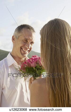 Newlyweds looking at each other View Large Photo Image Stock Photo - Newlyweds looking at each other. Fotosearch