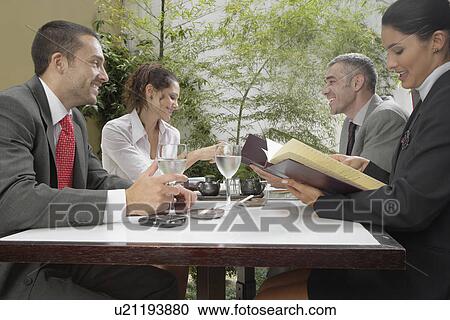 Business meeting in restaurant (low angle view) View Large Photo Image Stock Image - Business meeting in restaurant (low angle view). Fotosearch