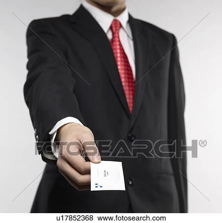 Stock Photo - Businessman Giving Businesscard. Fotosearch