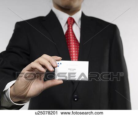 Stock Image - Businessman Showing Businesscard. Fotosearch