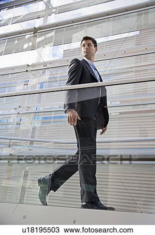 Businessman Walking on Ramp View Large Photo Image Stock Image - Businessman Walking on Ramp. Fotosearch