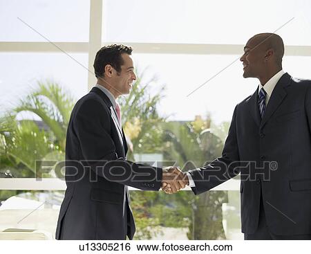 Businessmen shaking hands View Large Photo Image Stock Photograph - Businessmen shaking hands. Fotosearch