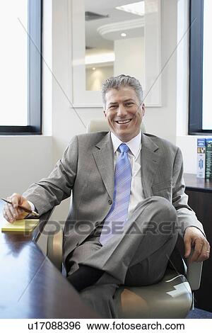Stock Photograph - Portrait of male executive. Fotosearch