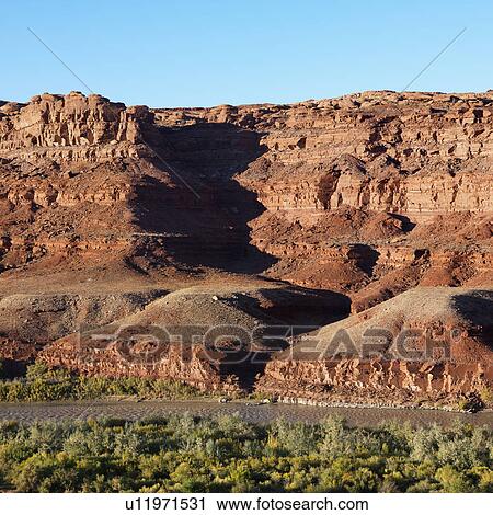 Small river running along rocky desert cliffs in Utah View Large Photo Image Stock Image - Small river running along rocky desert cliffs in Utah. Fotosearch