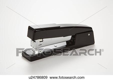 Stock Photo - Black stapler on white background.. Fotosearch