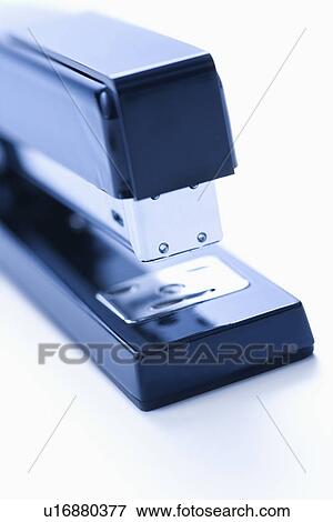 Stock Photo - Blue stapler on white background.. Fotosearch