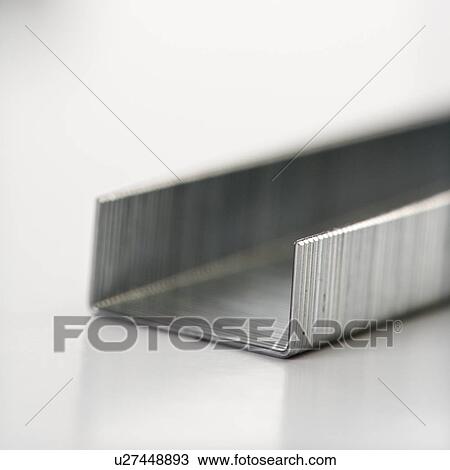 Close up of a row of new staples. View Large Photo Image Stock Image - Close up of a row of new staples.. Fotosearch