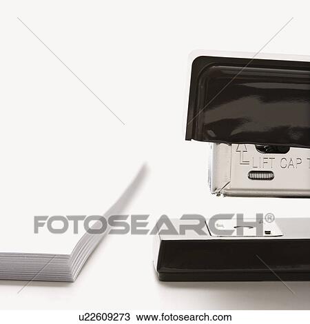 Close up of black stapler on white background with stack of paper. View Large Photo Image Stock Image - Close up of black stapler on white background with stack of paper.. Fotosearch