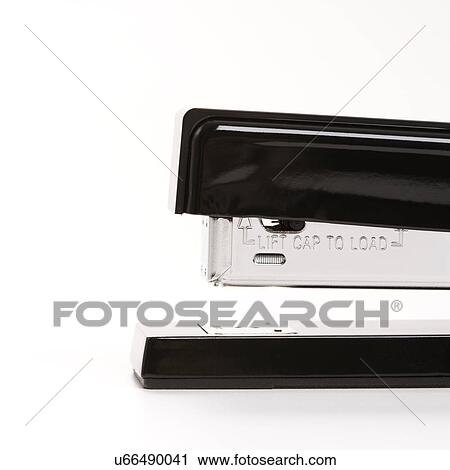 Stock Image - Close up of black stapler on white background.. Fotosearch