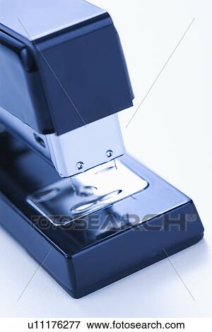 Stock Photo - Close up of blue stapler on white background.. Fotosearch