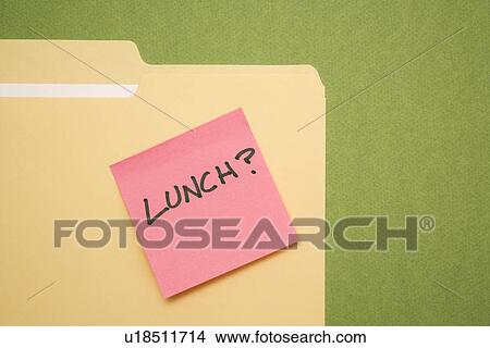Folder with pink sticky note reading lunch on a green background View Large Photo Image Picture - Folder with pink sticky note reading lunch on a green background. Fotosearch
