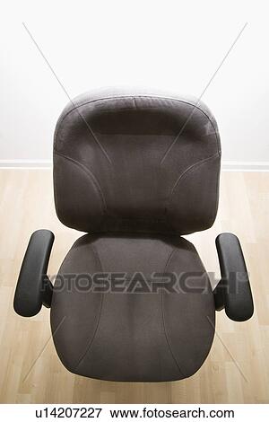 High angle view of empty office desk chair View Large Photo Image Stock Photo - High angle view of empty office desk chair. Fotosearch