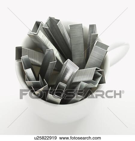 Many staples arranged in a coffee cup. View Large Photo Image Stock Photo - Many staples arranged in a coffee cup.. Fotosearch