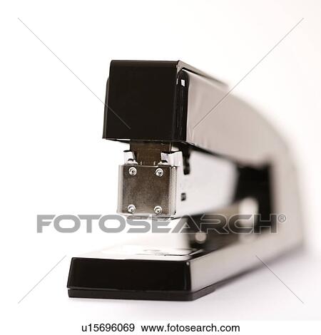 Selective focus of black stapler on white background. View Large Photo Image Stock Photo - Selective focus of black stapler on white background.. Fotosearch