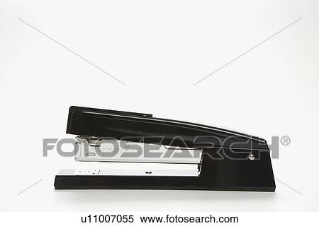 Stock Photography - Side view of black stapler on white background.. Fotosearch