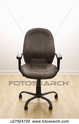 Still life of empty office desk chair. View Large Photo Image Stock Photo - Still life of empty office desk chair.. Fotosearch