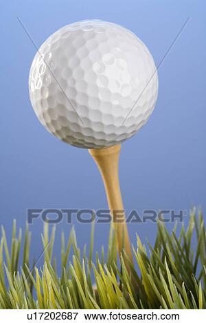 Studio shot of a golfball on a tee in grass. View Large Photo Image Stock Photo - Studio shot of a golfball on a tee in grass.. Fotosearch