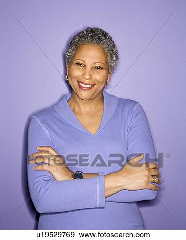 Adult female smiling looking at viewer View Large Photo Image Stock Photo - Adult female smiling looking at viewer. Fotosearch