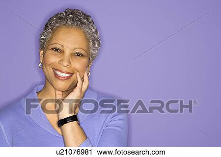 African American mature adult female smiling looking at viewer. View Large Photo Image Stock Image - African American mature adult female smiling looking at viewer.. Fotosearch