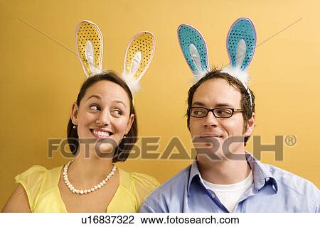Couple wearing rabbit ears View Large Photo Image Stock Image - Couple wearing rabbit ears. Fotosearch