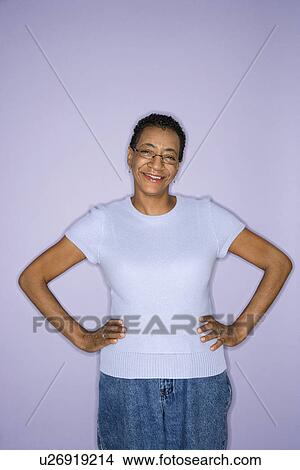 Female standing looking at viewer View Large Photo Image Picture - Female standing looking at viewer. Fotosearch