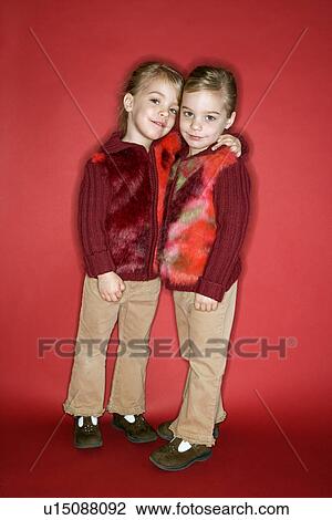 Female twins embrace View Large Photo Image Stock Image - Female twins embrace. Fotosearch