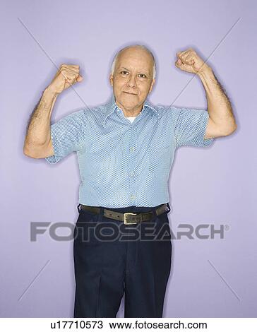 Stock Image - Male flexing muscles. Fotosearch