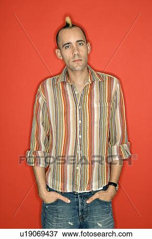 Stock Photo - Man with mohawk standing. Fotosearch