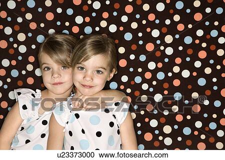 Twins looking at viewer View Large Photo Image Stock Image - Twins looking at viewer. Fotosearch