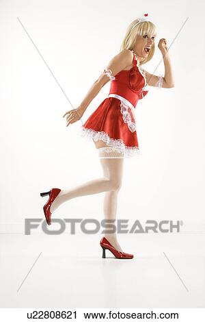 Blonde Caucasian young woman in french maid oufit knocking on imaginary door. View Large Photo Image Stock Image - Blonde Caucasian young woman in french maid oufit knocking on imaginary door.. Fotosearch