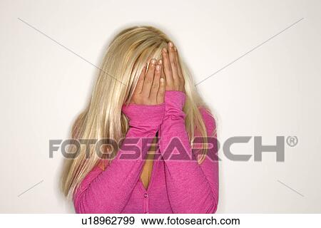 Portrait of blonde woman wearing fuchsia covering face with hands. View Large Photo Image Stock Photo - Portrait of blonde woman wearing fuchsia covering face with hands.. Fotosearch