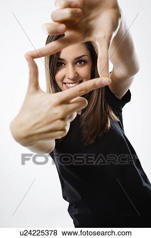 Portrait of female smiling with hands in foreground. View Large Photo Image Stock Photo - Portrait of female smiling with hands in foreground.. Fotosearch