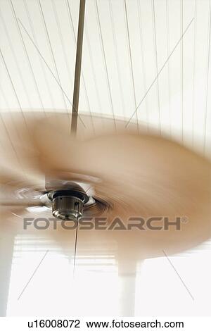 Stock Image - Ceiling fan with motion blur.. Fotosearch