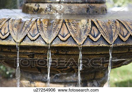 Close-up of fountain with water flowing from it. View Large Photo Image Stock Photograph - Close-up of fountain with water flowing from it.. Fotosearch