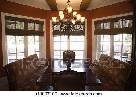 Dining room with table and chairs in affluent home. View Large Photo Image Stock Image - Dining room with table and chairs in affluent home.. Fotosearch