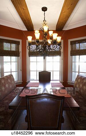 Dining room with table and chairs in affluent home View Large Photo Image Stock Photograph - Dining room with table and chairs in affluent home. Fotosearch