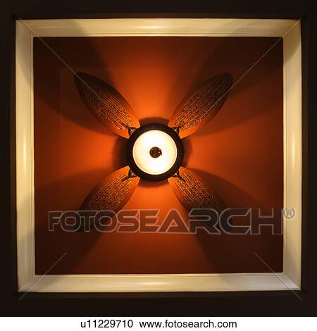 Low angle view of ceiling fan lamp View Large Photo Image Stock Image - Low angle view of ceiling fan lamp. Fotosearch