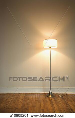 Still life of floor lamp on hardwood floor. View Large Photo Image Stock Image - Still life of floor lamp on hardwood floor.. Fotosearch