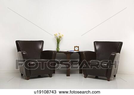 Two brown armchairs and table with daffofils still life. View Large Photo Image Stock Image - Two brown armchairs and table with daffofils still life.. Fotosearch
