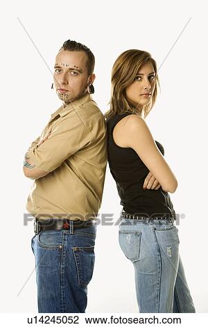 Caucasian mid-adult man and teen female standing back to back. View Large Photo Image Stock Image - Caucasian mid-adult man and teen female standing back to back.. Fotosearch